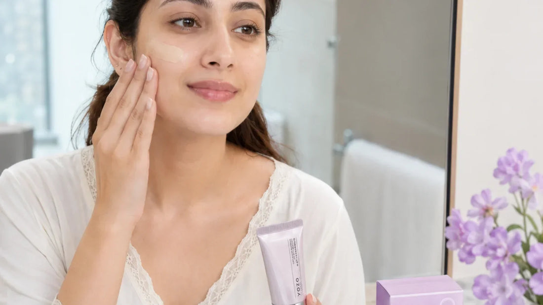 Woman applying YOZO Brightening BB Cream at a mirror as the final step of a daytime routine