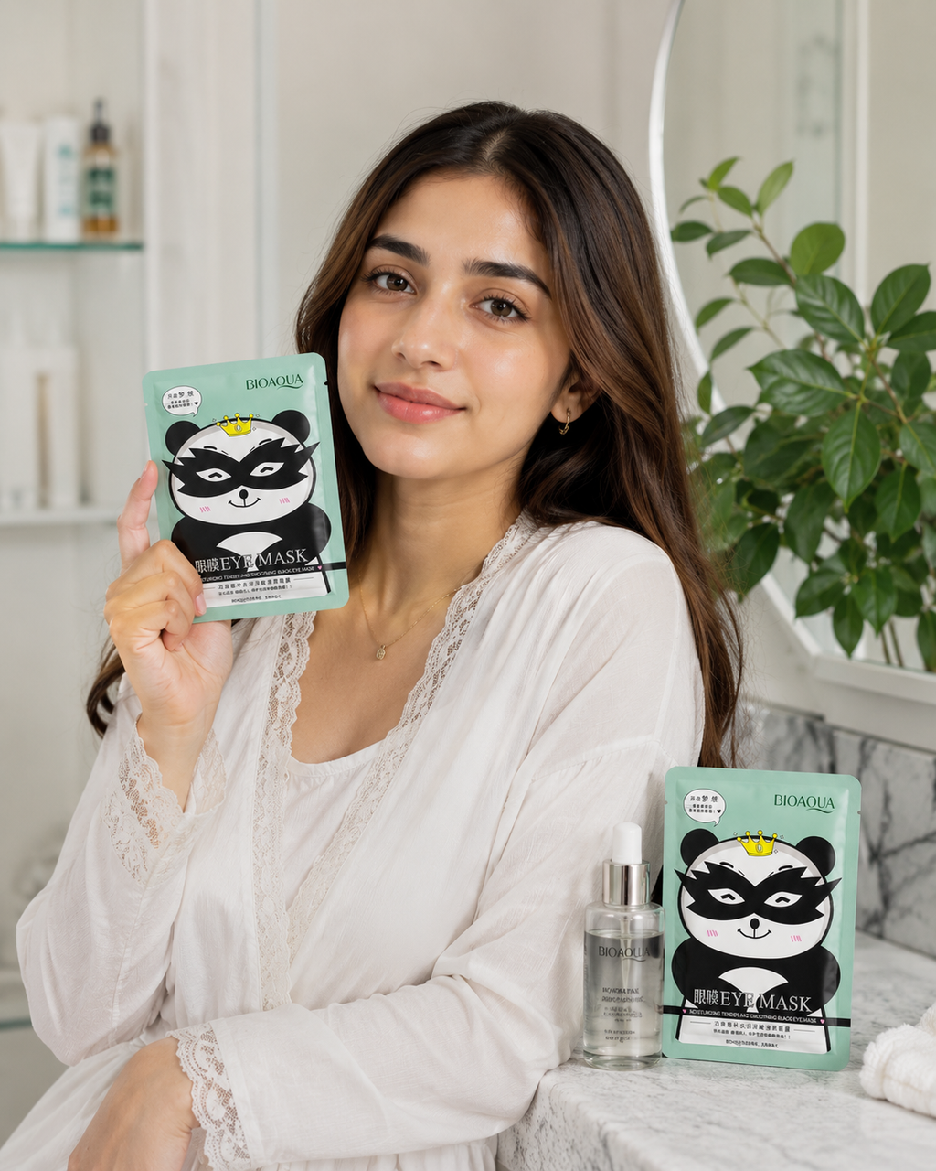 Woman holding a BIOAQUA sheet mask | BIOAQUA Soothing Black Eye Mask