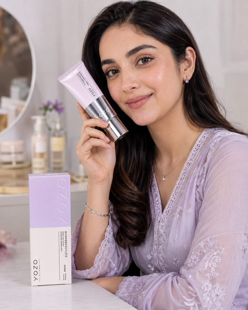 Woman holding a BB Cream product with a blurred background | Yozo Brightening BB Cream